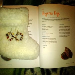 A handmade healing stone round shaped dangle earrings